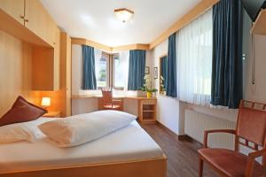 Postel nebo postele na pokoji v ubytování Hotel Condor