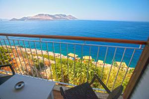 a balcony with a view of the ocean at Sunset Villa Hotel in Kaş