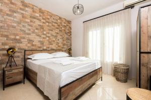 Ένα ή περισσότερα κρεβάτια σε δωμάτιο στο Arsenoi's Pool Villa +33 φωτογραφίες