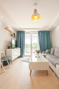 Telewizja i/lub zestaw kina domowego w obiekcie Apartament słoneczny