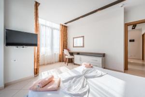 Postel nebo postele na pokoji v ubytování Hotel Kamomil