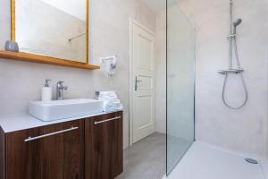 a bathroom with a sink and a shower at Bed & Breakfast Došen IV in Baška +21 photos