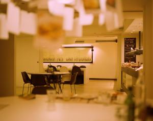 a dining room with tables and chairs in a restaurant at Pol & Grace Hotel in Barcelona +27 photos