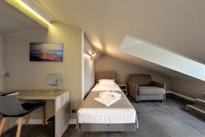 En eller flere senge i et værelse på Barocco Wave Hotel