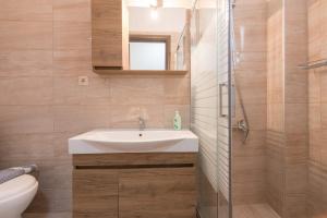 a bathroom with a sink and a shower at Villa Venetta in Skala Rachoniou +22 photos