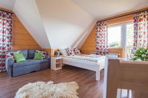 Ένα ή περισσότερα κρεβάτια σε δωμάτιο στο Gliczarówka