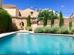 a swimming pool in the yard of a house at Almyrida Sands luxury stone villa in Xirostérnion