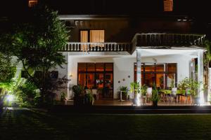 a house with a lit up front porch at night at Villa Santa Maria in Sibiu