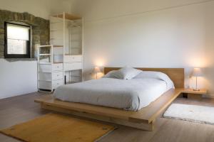 Postel nebo postele na pokoji v ubytování L'Abbraccio della Quercia - Apartments