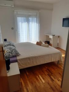 Postel nebo postele na pokoji v ubytování Apartmani Frano