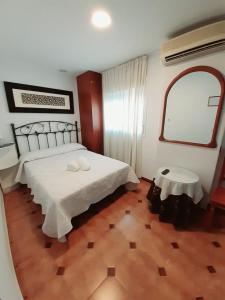 Posteľ alebo postele v izbe v ubytovaní Hostal Kokkola