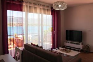 TV a/nebo společenská místnost v ubytování Apartments Tramonto