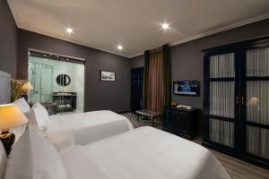 Voodi või voodid majutusasutuse Matilda Boutique Hotel & Spa toas