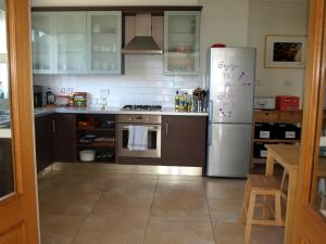 a kitchen with a refrigerator and a stove at The Lookout Ardara in Ardara