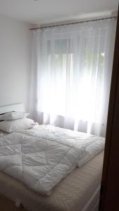 Postel nebo postele na pokoji v ubytování Lido riviera apartman