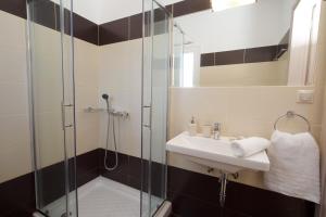 a bathroom with a sink and a shower at Alexandra's Residence in Kefallonia +48 photos