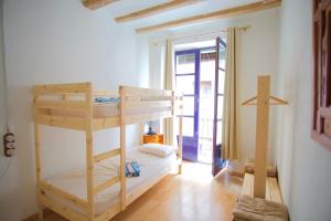 a bedroom with two bunk beds in a room at La Lleona Apartment in Girona