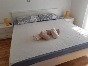 Postel nebo postele na pokoji v ubytování Apartmani Frano