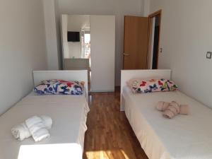 Postel nebo postele na pokoji v ubytování Apartmani Frano + 37 fotografií