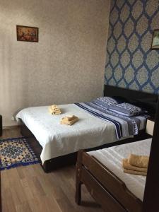 Postel nebo postele na pokoji v ubytování Guest House Loza