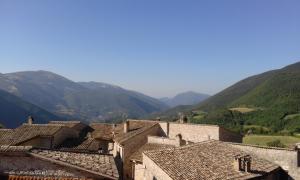 a view of a village with mountains in the background at Agriturismo Terramia in Meggiano +19 photos