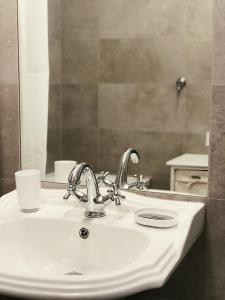 a bathroom with a sink and a mirror at Family Hel in Hel +11 photos
