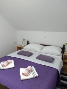 Ένα ή περισσότερα κρεβάτια σε δωμάτιο στο Apartman NINA