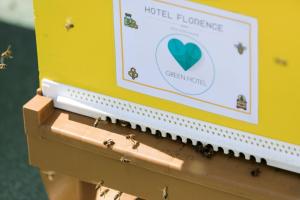 a box with ants on it with a sign on it at Hotel Florence Nice in Nice