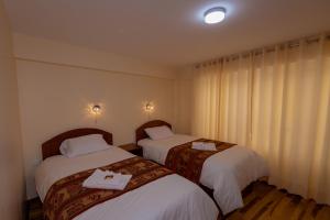 Voodi või voodid majutusasutuse Hawka Inka Hostal - Cusco toas