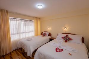 Voodi või voodid majutusasutuse Hawka Inka Hostal - Cusco toas
