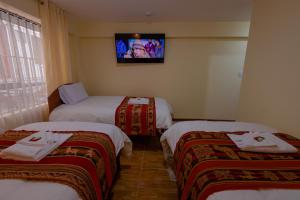 Voodi või voodid majutusasutuse Hawka Inka Hostal - Cusco toas