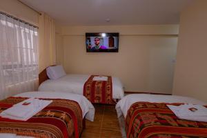 Voodi või voodid majutusasutuse Hawka Inka Hostal - Cusco toas