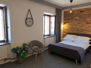 Łóżko lub łóżka w pokoju w obiekcie Apartamenty Stary Browar Oleśnica
