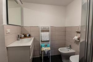 a small bathroom with a sink and a toilet at La BRIGNA B&B Il bosco sul mare in Genoa