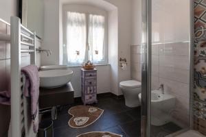 a bathroom with a sink and a toilet and a shower at La BRIGNA B&B Il bosco sul mare in Genoa
