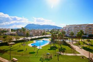 a view of a park with a swimming pool and buildings at Residencial Playa Sol I in Denia