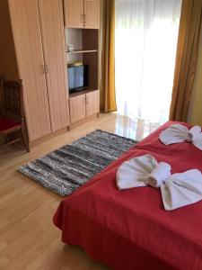 Posteľ alebo postele v izbe v ubytovaní Green Park Apartment