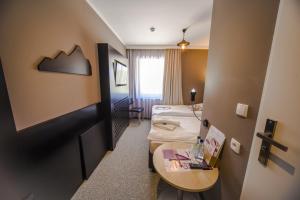 Postel nebo postele na pokoji v ubytování Hotel 4