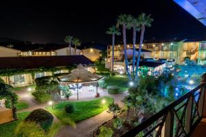 a view of a courtyard at night with lights at Nicotera Beach Village in Nicotera Marina