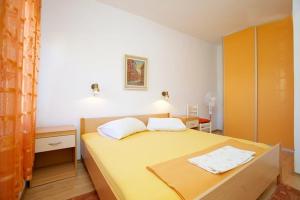 Postel nebo postele na pokoji v ubytování Apartments Delic