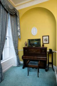 a living room filled with furniture and a piano at Harrington Hall in Dublin