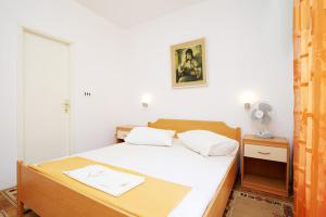 Postel nebo postele na pokoji v ubytování Apartments Delic