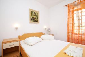 Postel nebo postele na pokoji v ubytování Apartments Delic