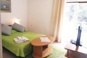 Postel nebo postele na pokoji v ubytování Apartments Delic