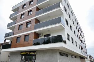 a building with balconies on the side of it at Relax Teslić in Teslić