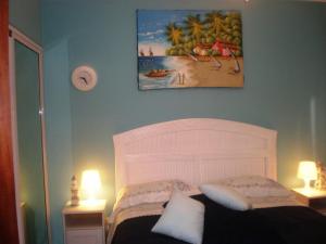 a bedroom with a bed with a white head board at Vanilla House in Bayahibe +35 photos