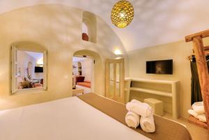 Ένα ή περισσότερα κρεβάτια σε δωμάτιο στο Pasithea Suites