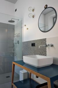 a bathroom with a sink and a mirror at INVENTO bnb unconventional maison in Civitanova Marche +55 photos