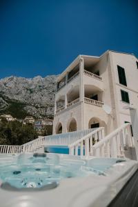 a house with a swimming pool in front of it at Villa Hills in Makarska