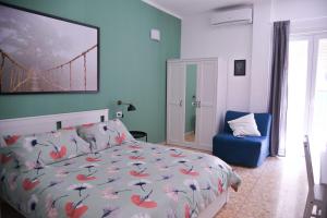 a bedroom with a bed and a bridge painting on the wall at Vatican Mirò Holidays in Rome